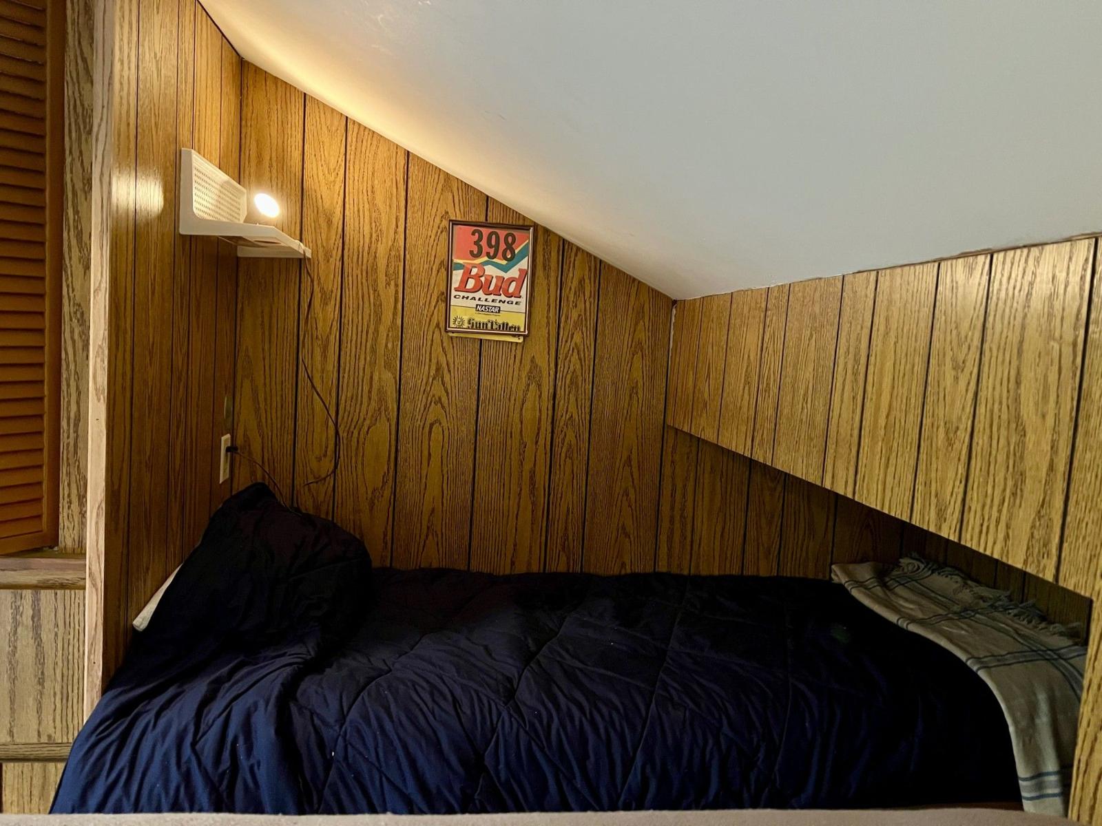 Cozy wood-paneled sleeping nook