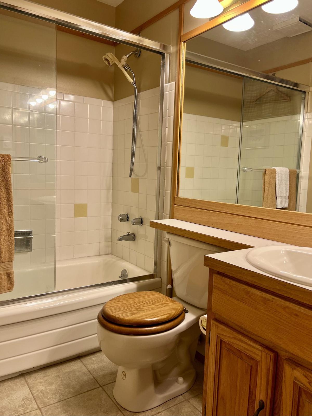 Full bathroom with tub and shower